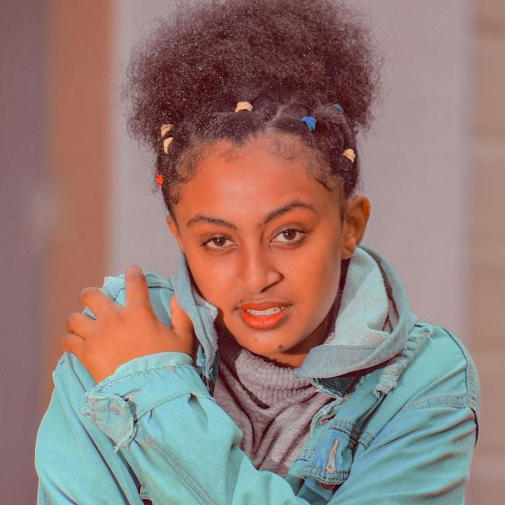 Alex Moreno, Lead Design Curator at Calm River Path, reviewing corporate floral arrangements